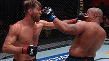 Stipe Miocic pokes Daniel Cormier in the eye during their UFC 252 heavyweight title fight.