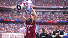 Mile Jedinak, seen here after Aston Villa earned EPL promotion in 2019, has retired from football.