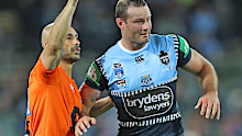 Boyd Cordner of the Blues is assisted by a trainer after a head knock