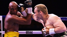 Julio Cesar Chavez Jr (R) punches Anderson Silva (L) during a fight in Guadalajara, Mexico.