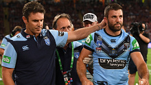NSW coach Brad Fittler consoles Blues fullback James Tedesco after he was ruled out of last year's State of Origin decider with concussion.