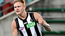 Jaidyn Stephenson of the Magpies celebrates kicking a goal