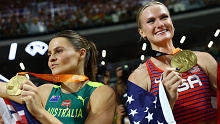 Australia's Nina Kennedy (left) and the United States' Katie Moon celebrate sharing pole vault gold at the world athletics championships.