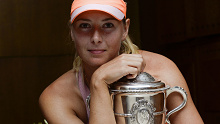 Maria Sharapova with her final Grand Slam trophy, at the 2014 French Open.
