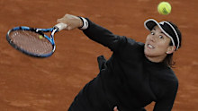 Garbine Muguruza hits a smash in her French Open loss to Danielle Collins.