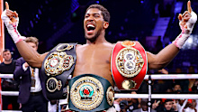 Anthony Joshua with his world title belts after beating Andy Ruiz.