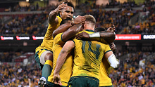 Genia celebrates one of his Wallabies teammates' tries on the night
