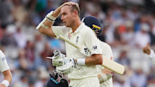 Players leave the Lord's pitch after receiving a warning of a thunder and lightning during the second day of the test match between England and Ireland