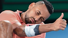 Nick Kyrgios gives Rafael Nadal a thumbs up after stumbling in their Australian Open match.