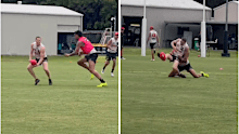 Ugle-Hagan chases down Rowell at training.