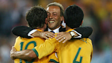 Socceroos assistant coach Johan Neeskens huge Harry Kewell and Tim Cahill after the Socceroos final group match against Croatia at the 2006 FIFA World Cup in Germany.