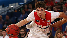 LaMelo Ball of the Hawks drives to the basket against Bryce Cotton of the Wildcats