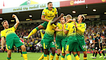 Norwich players celebrate Teemu Pukki's third goal in a win over Manchester City,