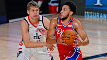  Ben Simmons #25 of the Philadelphia 76ers drives on Moritz Wagner #21 of the Washington Wizards