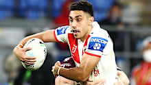 Teen Dragons star Tyrell Sloan tries to slip through a tackle in the Sea Eagles clash.