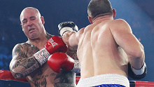 Paul Gallen punches Lucas Browne as their bout winds to its brutal conclusion.