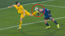 Dortmund player Ramy Bensebaini (yellow) was given a second yellow card for this challenge on Nikola Krstovic.
