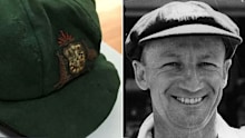 The 1928-29 Bradman baggy green and Sir Donald himself.