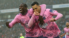 Dwight McNeil of Everton celebrates with teammate Abdoulaye Doucoure after scoring the team's fourth goal during the Premier League match between Brighton & Hove Albion and Everton FC at American Express Community Stadium on May 08, 2023 in Brighton, England. (Photo by Charlie Crowhurst/Getty Images)