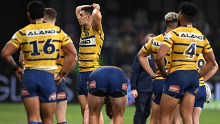 Eels players look dejected after losing to the Roosters on Saturday night.
