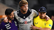 Melbourne Storm prop Christian Welch being helped from the field after suffering an Achilles injury.