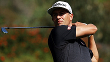 Adam Scott plays an iron shot during the third round at Riviera.