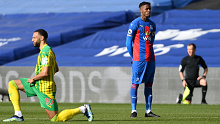 Wilfried Zaha of Crystal Palace stands at kick off as Matt Phillips of West Bromwich Albion takes a knee.