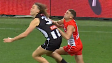 Tom Papley pushes Darcy Moore in the back.
