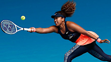 Naomi Osaka plays a forehand in her fourth round match against Garbine Muguruza during day seven of the 2021 Australian Open.