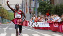 Eliud Kipchoge of Team Kenya crosses the finish line during the Men's Marathon.