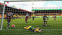West Ham's Michail Antonio (L) nets his hat-trick goal amid a haul of four that relegated Norwich.