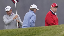 US president Donald Trump plays golf at Trump National Golf Club last year.