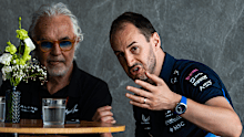 Oliver Oakes speaks with Alpine executive advisor Flavio Briatore in the team's hospitality suite during the Saudi Arabian Grand Prix.