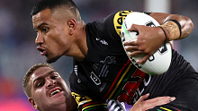 Panthers centre Stephen Crichton clashes with Storm's Brenko Lee during the NRL grand final.