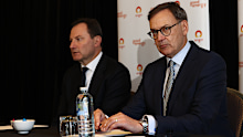 Origin Energy CEO Frank Calabria and Origin Energy Chairman Scott Perkins speak to the media after Brookfield's bid was rejected at a meeting held at the Shangri-La Hotel in Sydney.