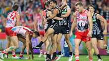 Wells was outstanding before his injury in the third quarter, kicking three first-half goals for the Magpies