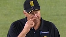 BBL umpire Greg Davidson scratches his nose rather than giving an LBW dismissal.