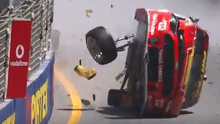 Scott McLaughlin's Ford Mustang is totalled and flipped on its side in a heavy Gold Coast 600 crash.