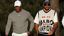 Tiger Woods of the United States and Jason Day of Australia walk the 15th fairway during the continuation of the first round of the 2024 Masters Tournament at Augusta National Golf Club on April 12, 2024 in Augusta, Georgia. (Photo by Jamie Squire/Getty Images)
