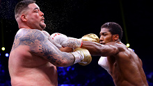Anthony Joshua (R) lands a jab on Andy Ruiz during their heavyweight world title fight.