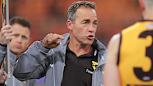 Hawks head coach Alastair Clarkson speaks to players 