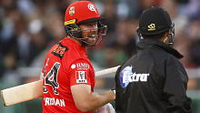 Renegades batsman Dan Christian speaks with the umpire after a tight dismissal against the Stars.