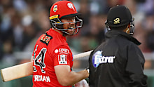 Renegades batsman Dan Christian speaks with the umpire after a tight dismissal against the Stars.