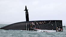  American Magic capsizes in race two against Prada Luna Rossa during the 2021 PRADA Cup Round Robins on Auckland Harbour on January 17, 2021 in Auckland,
