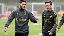 Sead Kolasinac and Ozil fought off the attackers.