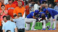 Chicago Cubs' Albert Almora Jr., center, takes a knee as Jason Heyward, left, and manager Joe Maddon, right, talk to him after hitting a foul ball into the stands