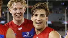 Oskar Baker of the Demons, Clayton Oliver of the Demons and Jack Viney of the Demons celebrate a win during the 2021 AFL Round 02 match between the St Kilda Saints and the Melbourne Demons at Marvel Stadium on March 27, 2021 in Melbourne, Australia. (Photo by Dylan Burns/AFL Photos via Getty Images)