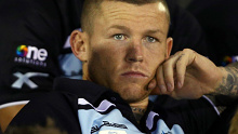 Injured Sharks five eighth Todd Carney watches from the stands during the round 11 NRL match between the Cronulla-Sutherland Sharks and the South Sydney Rabbitohs at Remondis Stadium on May 26, 2014 in Sydney, Australia.