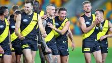 Dustin Martin and Sydney Stack (centre) celebrate a win in round 12