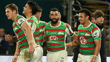 Alex Johnston celebrates one of his three tries against the Bulldogs with his Rabbitohs teammates